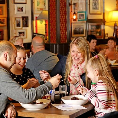 Families eating in The Vintage Inn